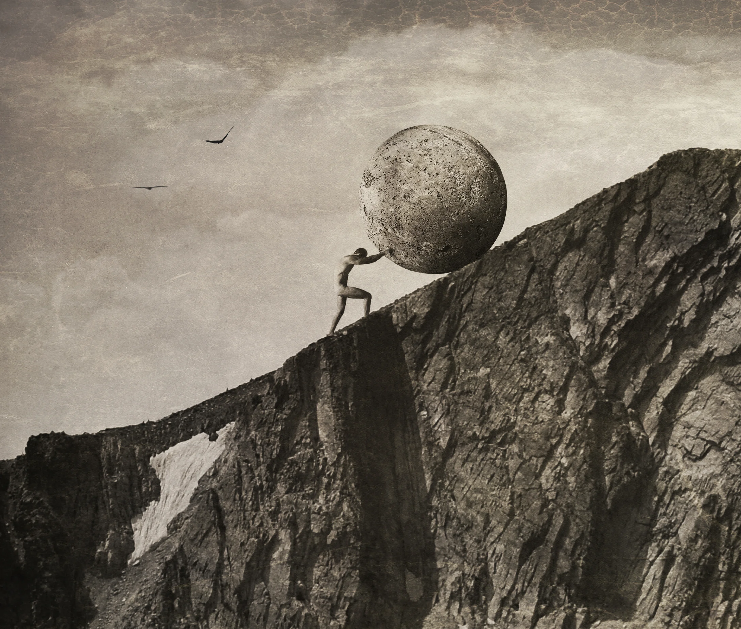 A small, bare figure pushing a huge round boulder up a steep rocky ridge under a cloudy sepia sky.